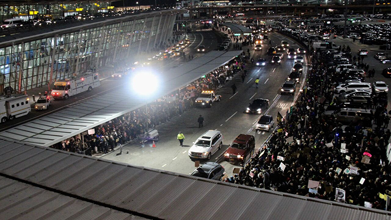 JFK protests Trump's ban